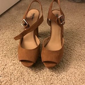 Size 8 1/2 suede platform heels.